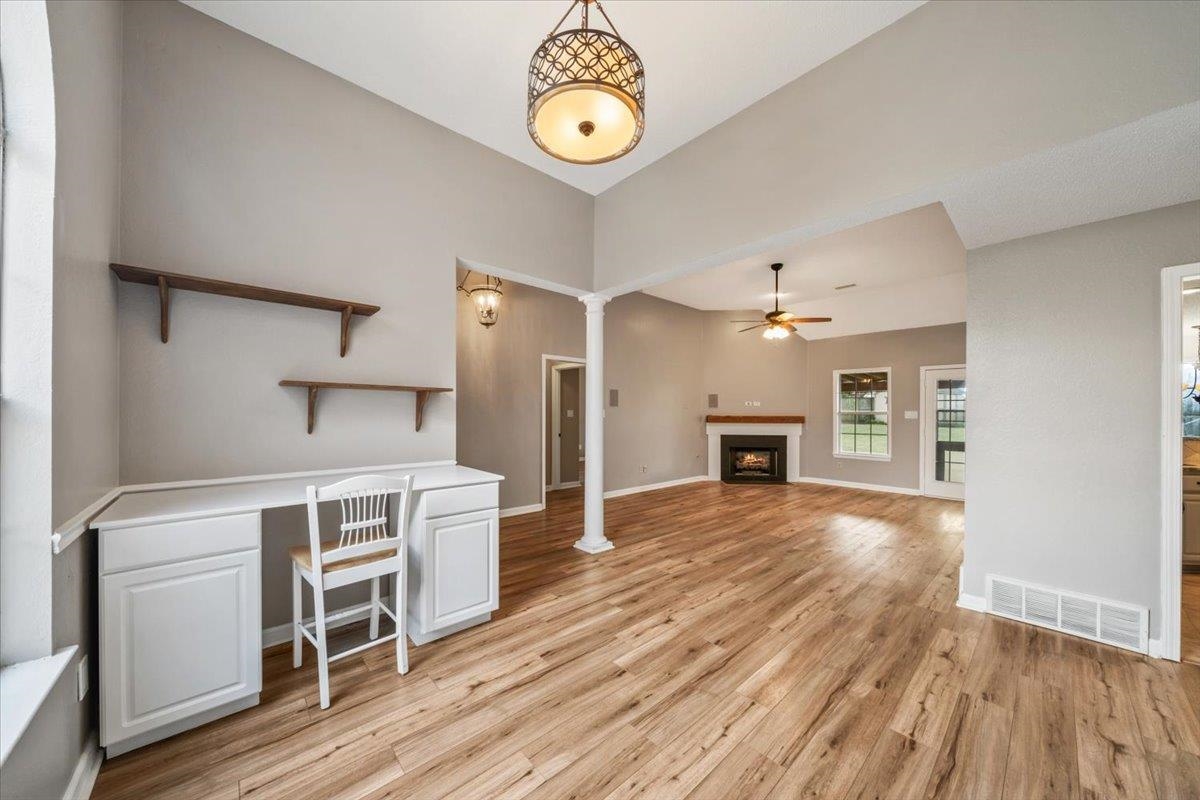 1279 River Ridge Drive Collierville, TN 38017 - Photo 6 of 28 a view of a kitchen with a stove cabinets and wooden floor