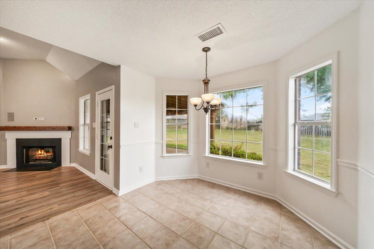 1279 River Ridge Drive Collierville, TN 38017 - Photo 8 of 28 a view of an empty room with window and fire place