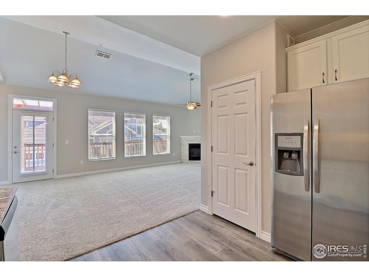 4672 West 20th Road, Unit 525 Greeley, CO 80634 - Photo 18 of 35 a view of an empty room with a kitchen