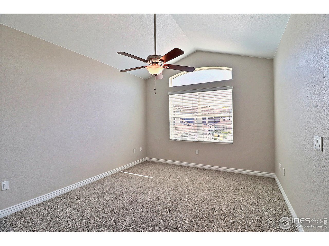 4672 West 20th Road, Unit 525 Greeley, CO 80634 - Photo 19 of 35 a view of an empty room with a window