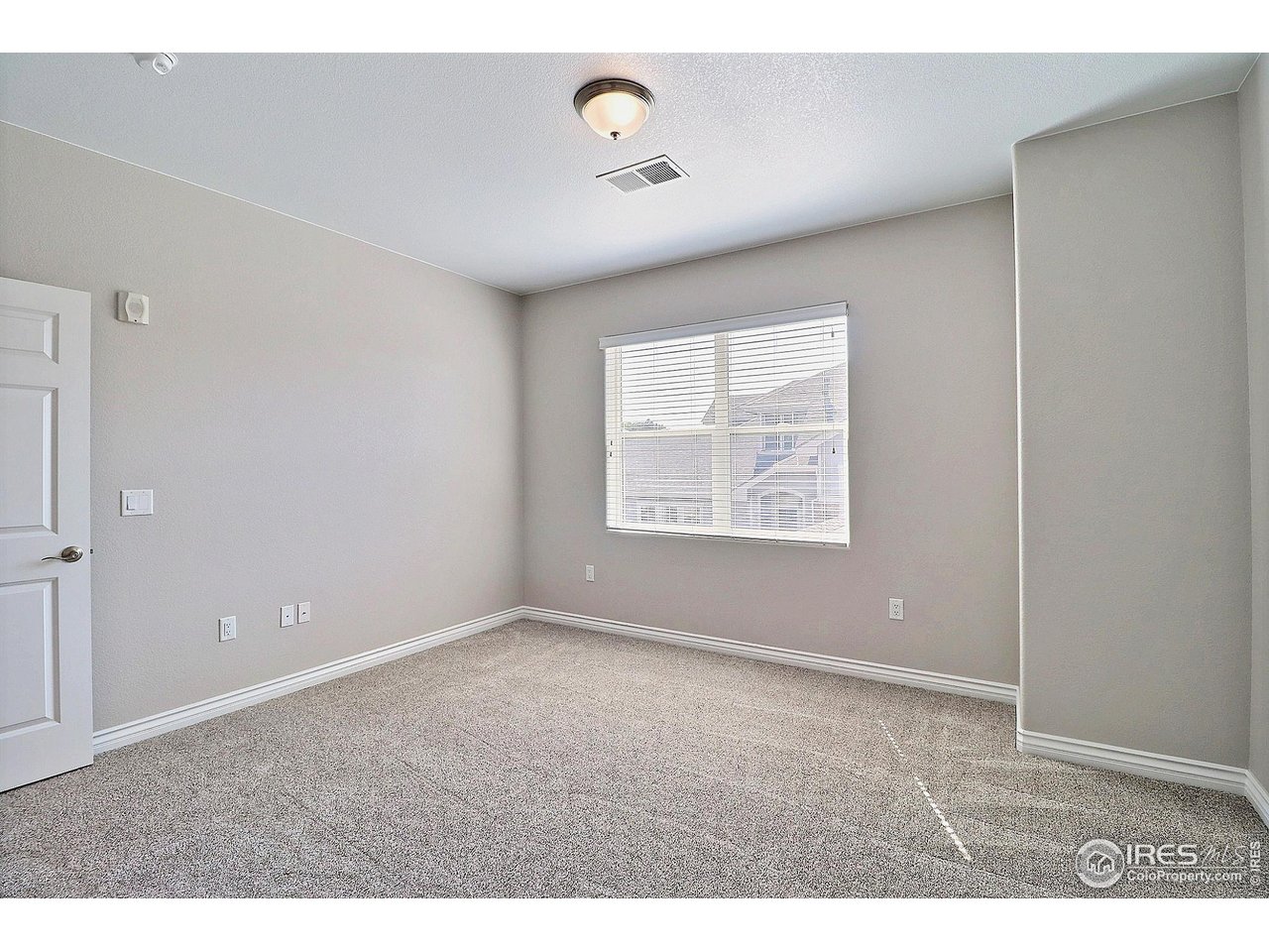 4672 West 20th Road, Unit 525 Greeley, CO 80634 - Photo 25 of 35 an empty room with windows