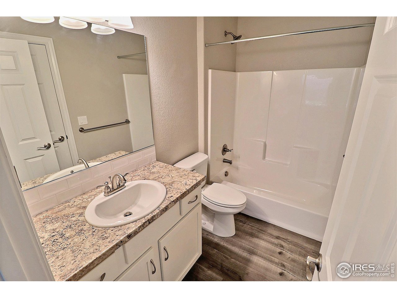 4672 West 20th Road, Unit 525 Greeley, CO 80634 - Photo 28 of 35 a bathroom with a sink and a mirror