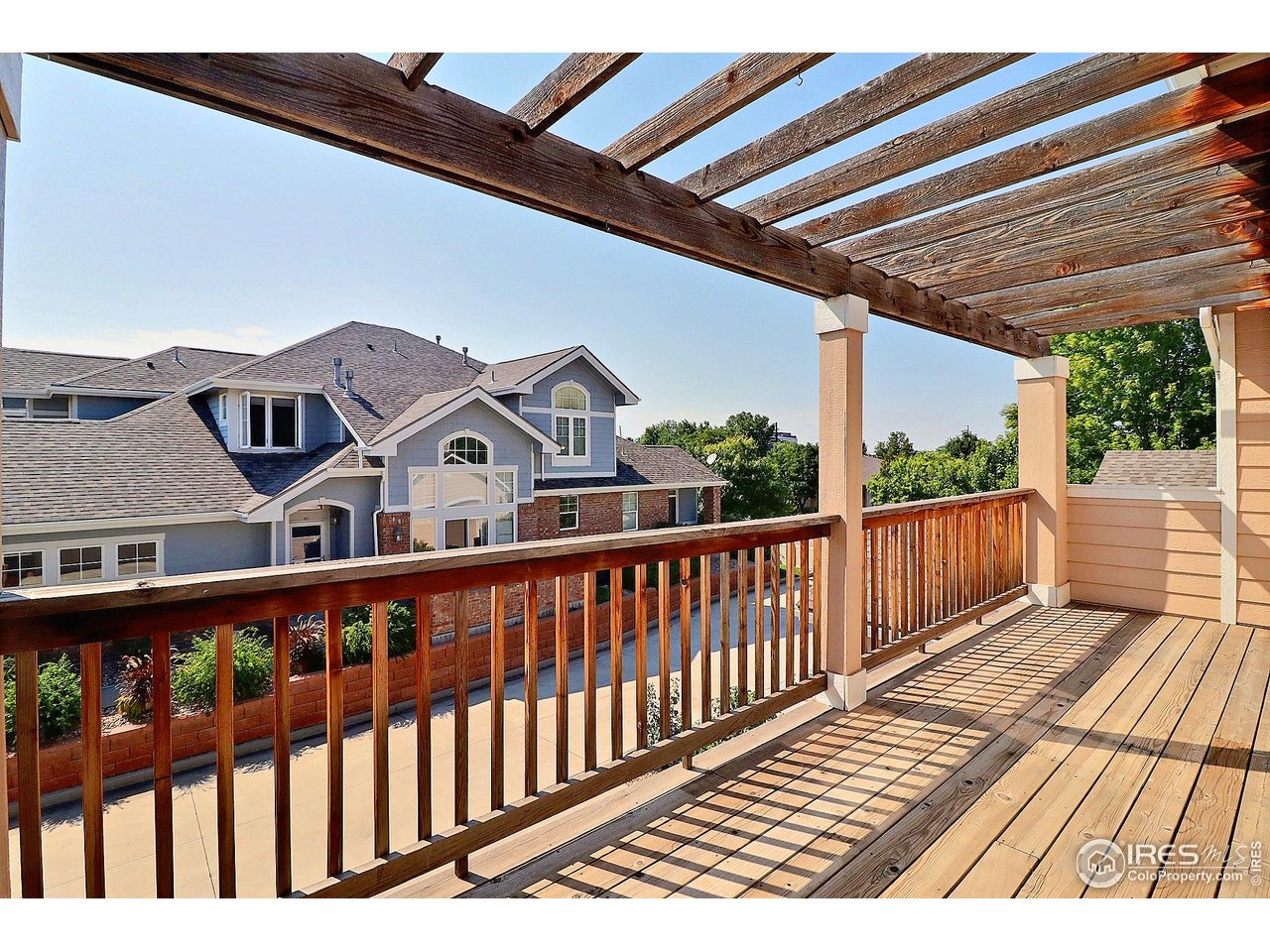 4672 West 20th Road, Unit 525 Greeley, CO 80634 - Photo 32 of 35 a view of a wooden chairs on the deck