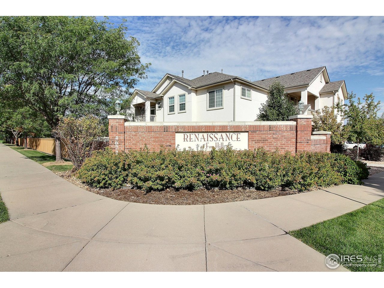 4672 West 20th Road, Unit 525 Greeley, CO 80634 - Photo 35 of 35 a front view of a house with a yard