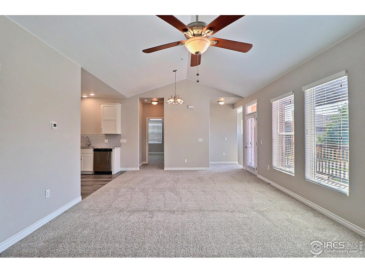 4672 West 20th Road, Unit 525 Greeley, CO 80634 - Photo 7 of 35 a view of an empty room with a kitchen