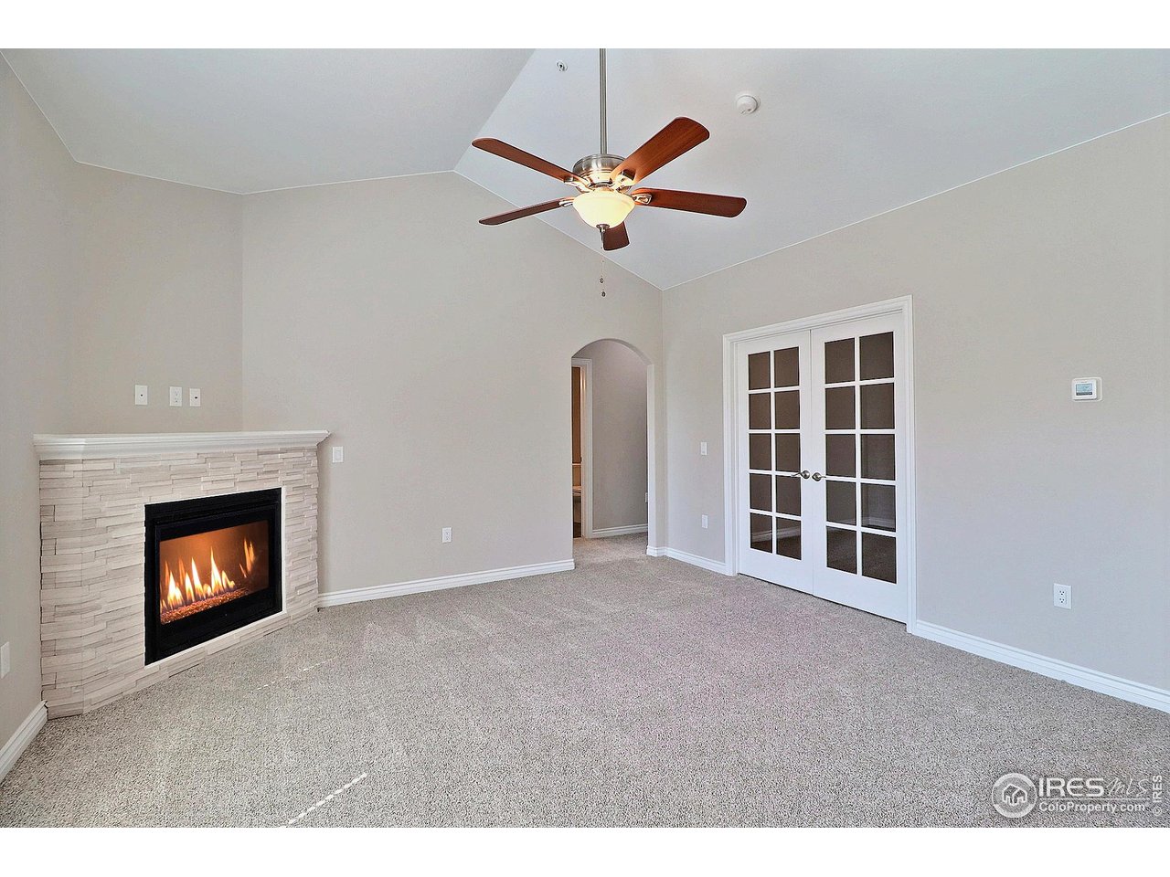 4672 West 20th Road, Unit 525 Greeley, CO 80634 - Photo 9 of 35 a view of an empty room with a fireplace