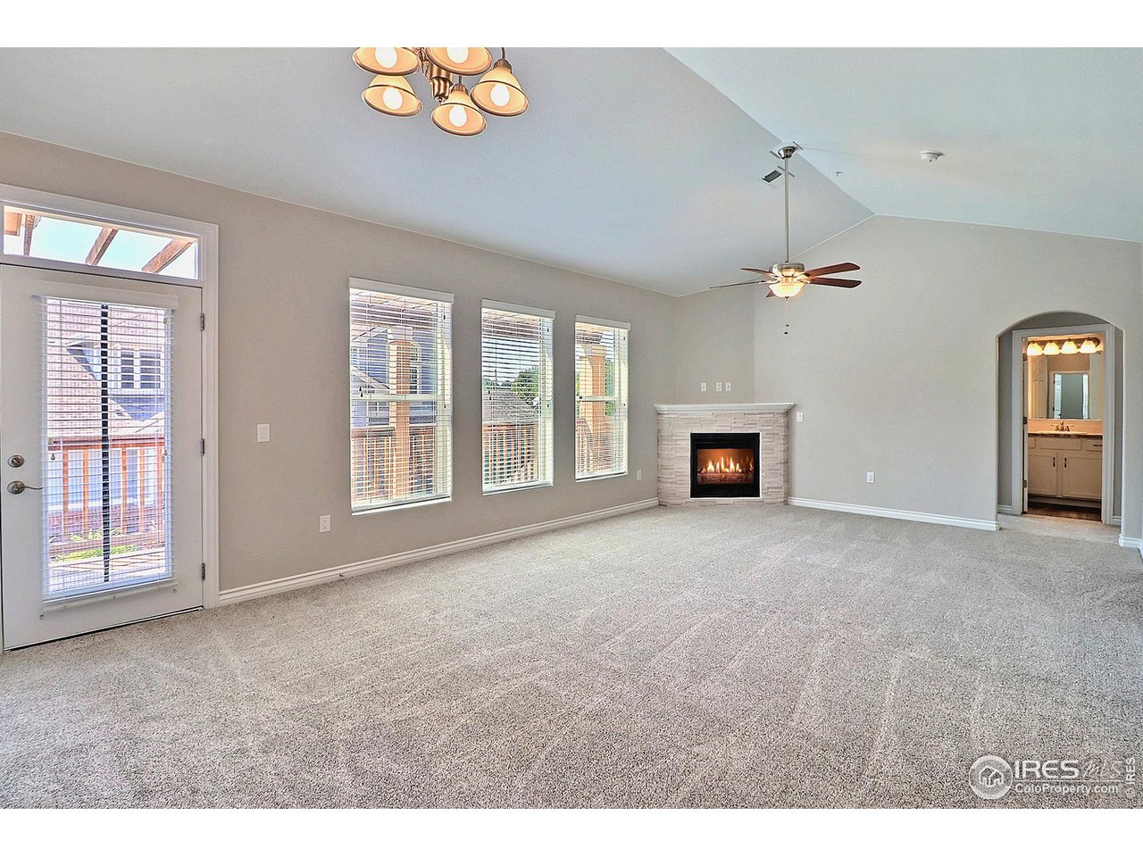 4672 West 20th Road, Unit 525 Greeley, CO 80634 - Photo 10 of 35 an empty room with windows and fireplace
