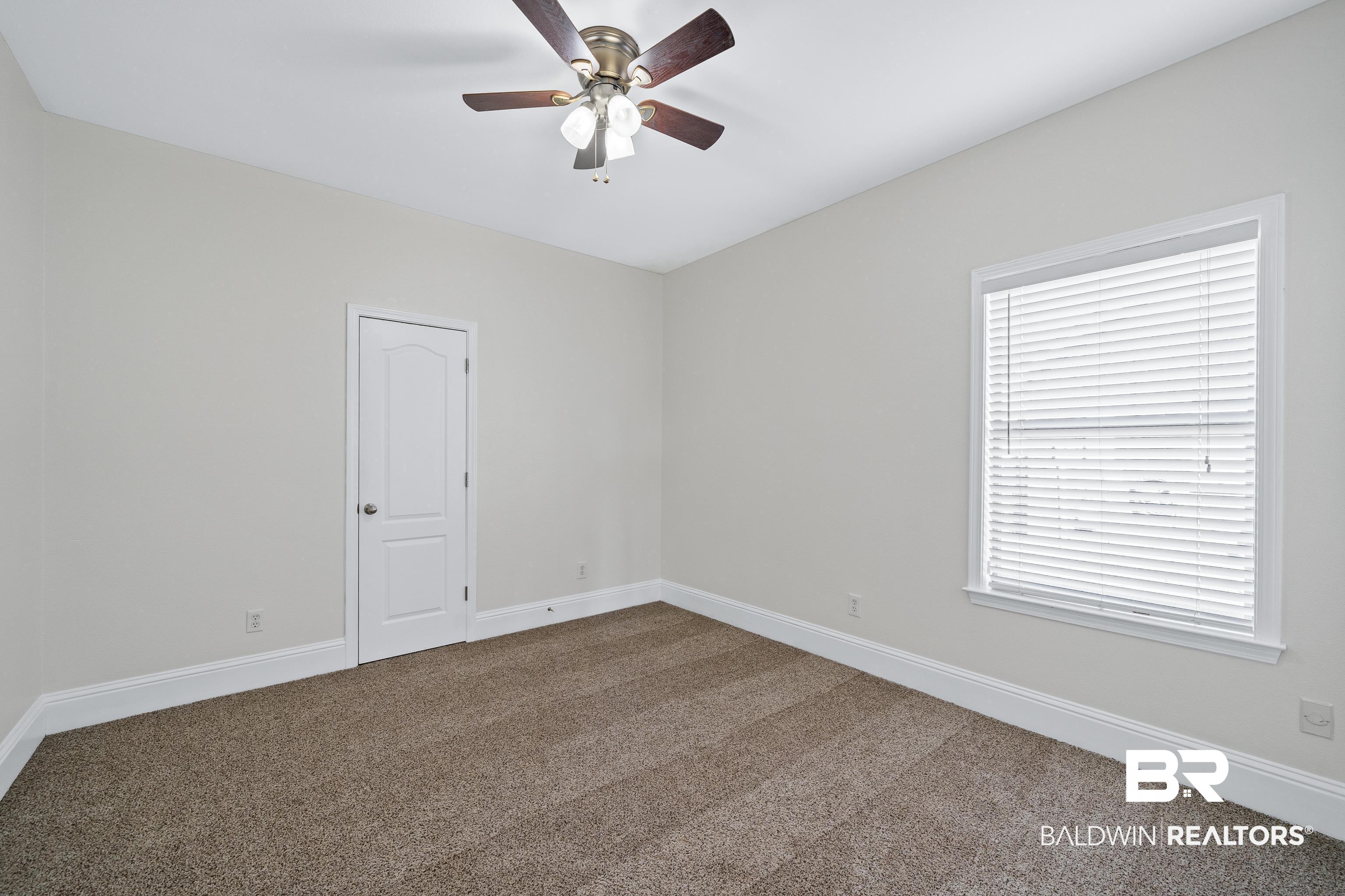 25350 Spindle Lane Daphne, AL 36526 - Photo 25 of 32 Carpeted spare room with ceiling fan