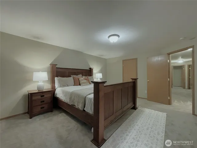 a bathroom with a toilet sink and shower