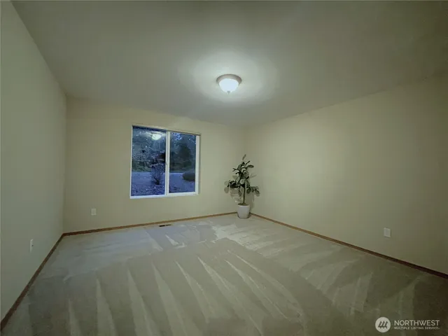 a view of swimming pool with a bench in front of house