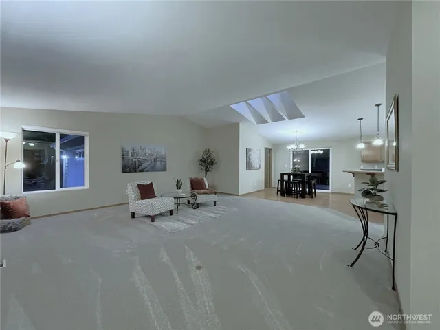 a living room with furniture and a table