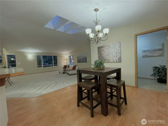 a view of a closet with wooden floor
