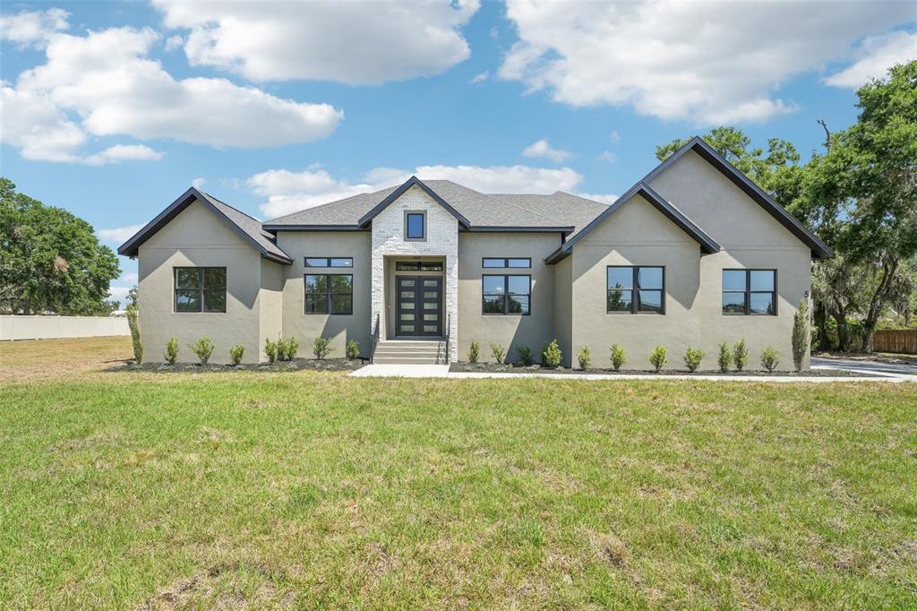 5174 Durant Road Dover, FL 33527 - Photo 1 of 1 a view of a house with backyard and garden