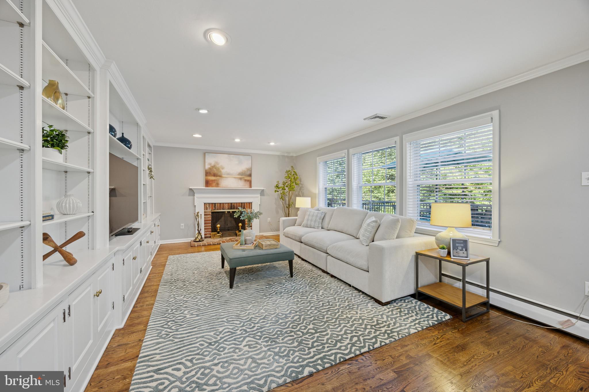 570 Fletcher Road Wayne, PA 19087 - Photo 27 of 54 a living room with fireplace furniture and a rug