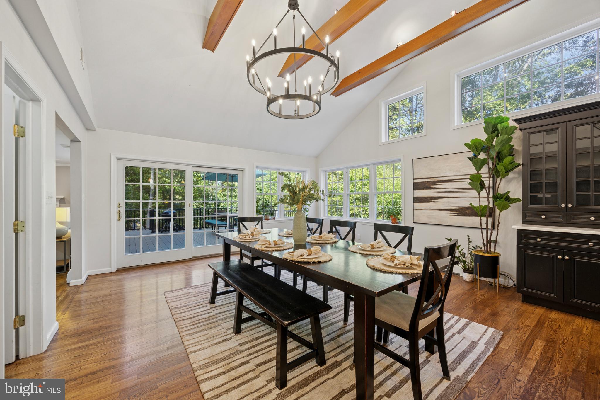 570 Fletcher Road Wayne, PA 19087 - Photo 29 of 54 a dining room with furniture a large window and wooden floor
