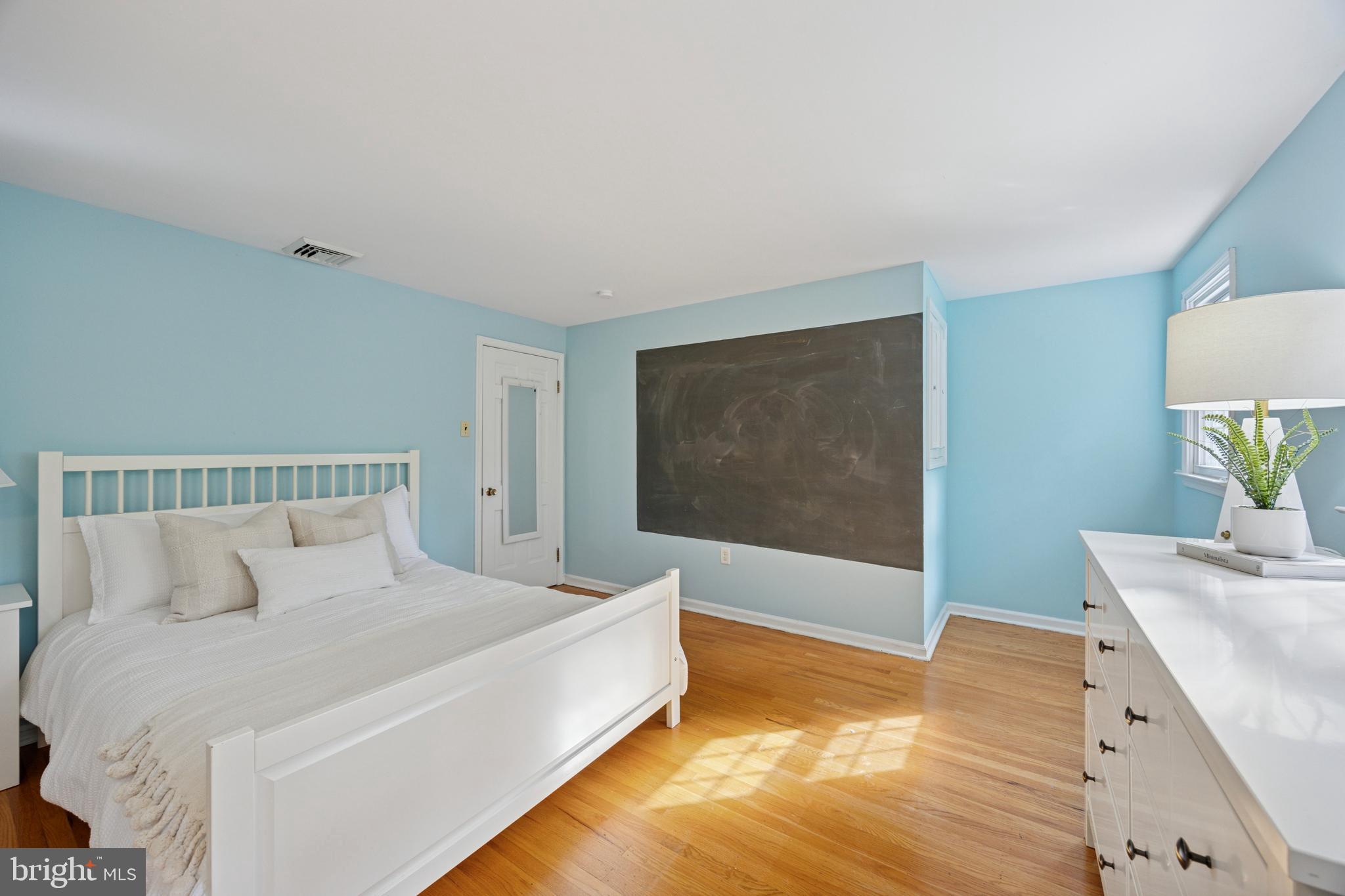 570 Fletcher Road Wayne, PA 19087 - Photo 45 of 54 a bedroom with a bed and a flat screen tv