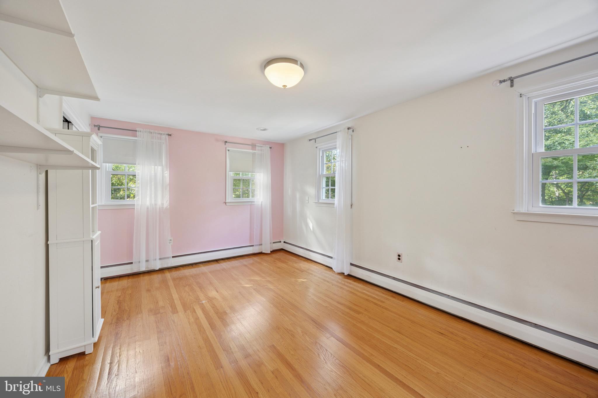 570 Fletcher Road Wayne, PA 19087 - Photo 47 of 54 an empty room with wooden floor and windows