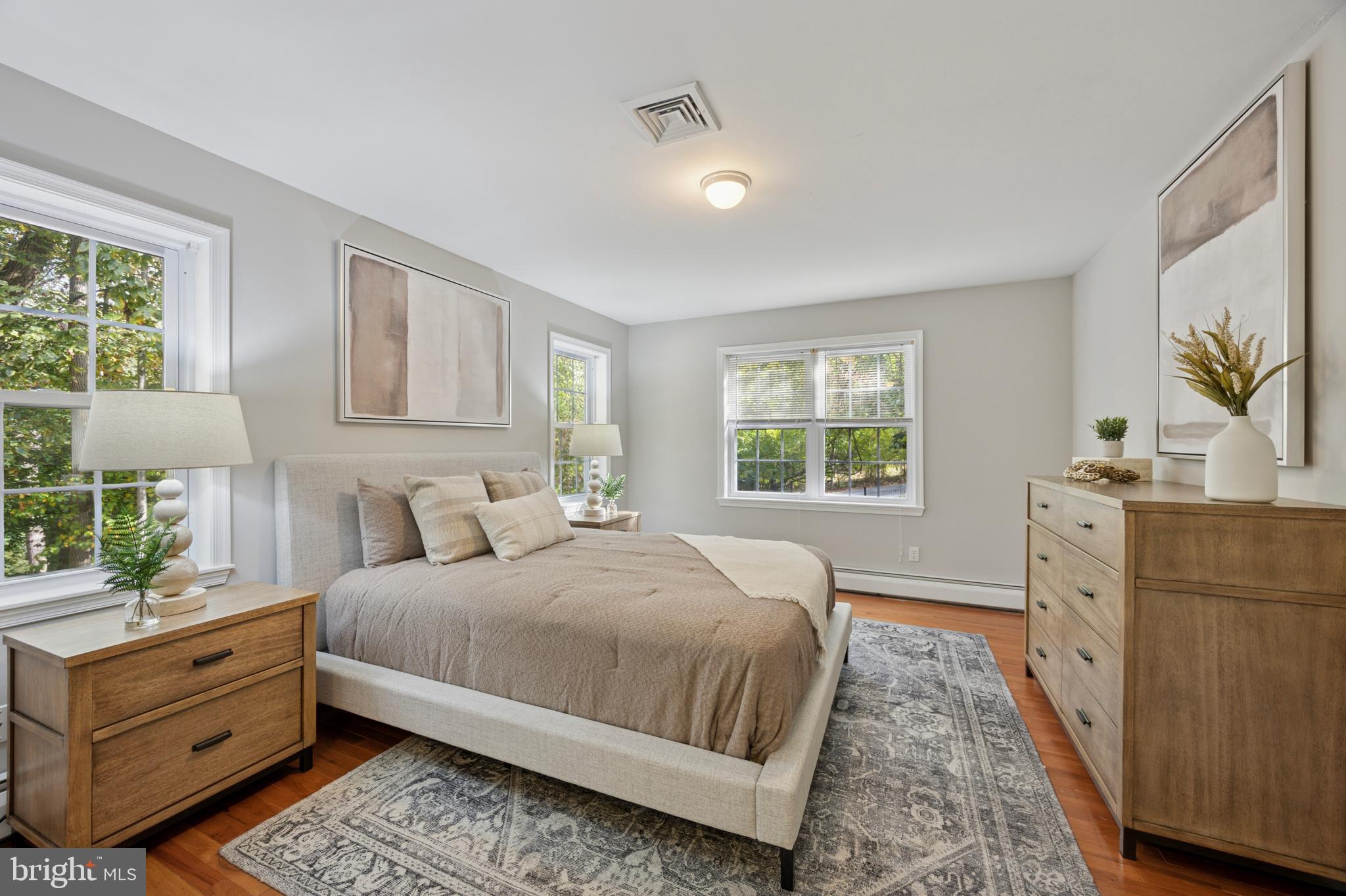 570 Fletcher Road Wayne, PA 19087 - Photo 53 of 54 a bedroom with a bed and a dresser