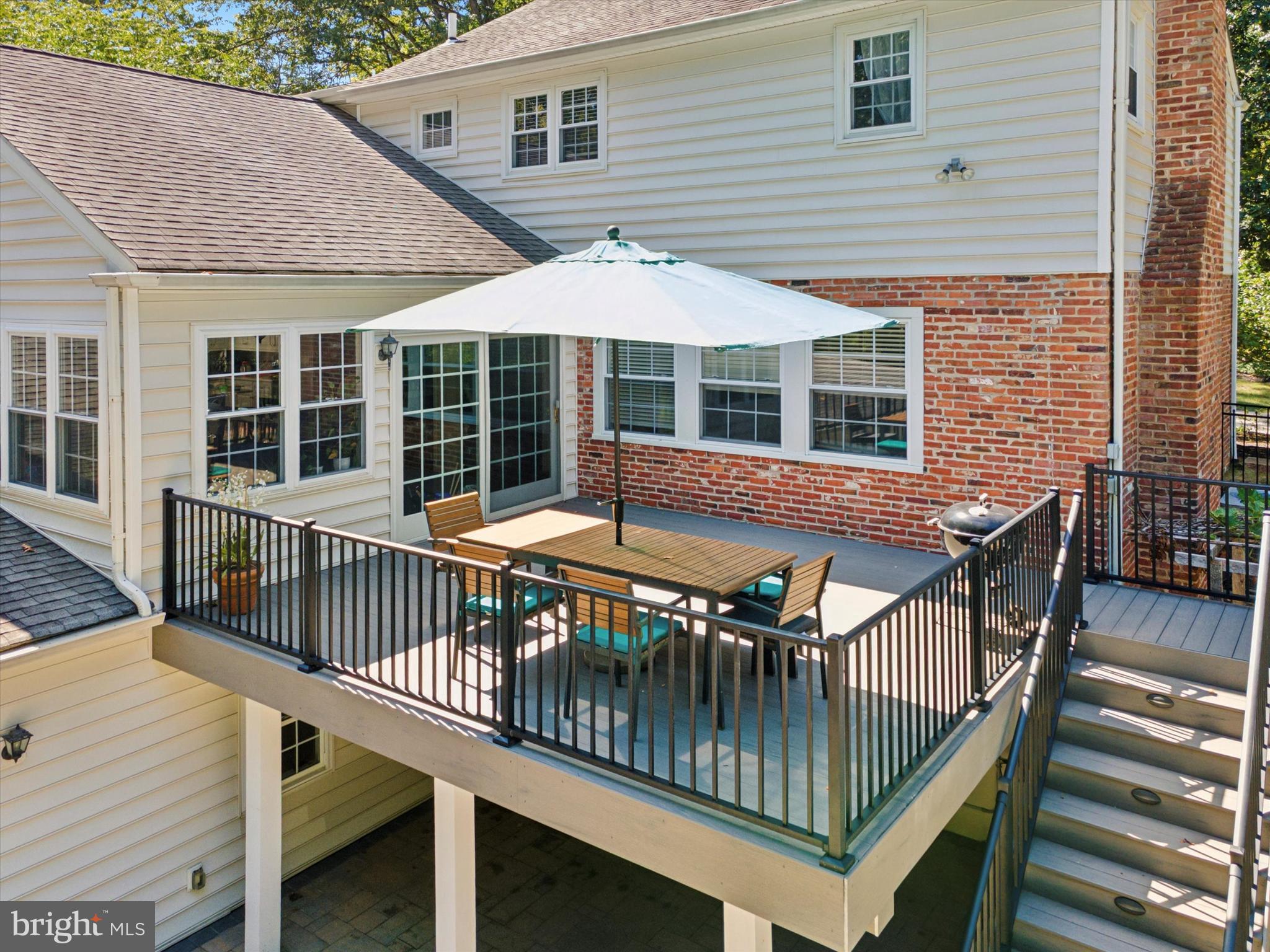 570 Fletcher Road Wayne, PA 19087 - Photo 7 of 54 a view of a house with wooden deck and furniture