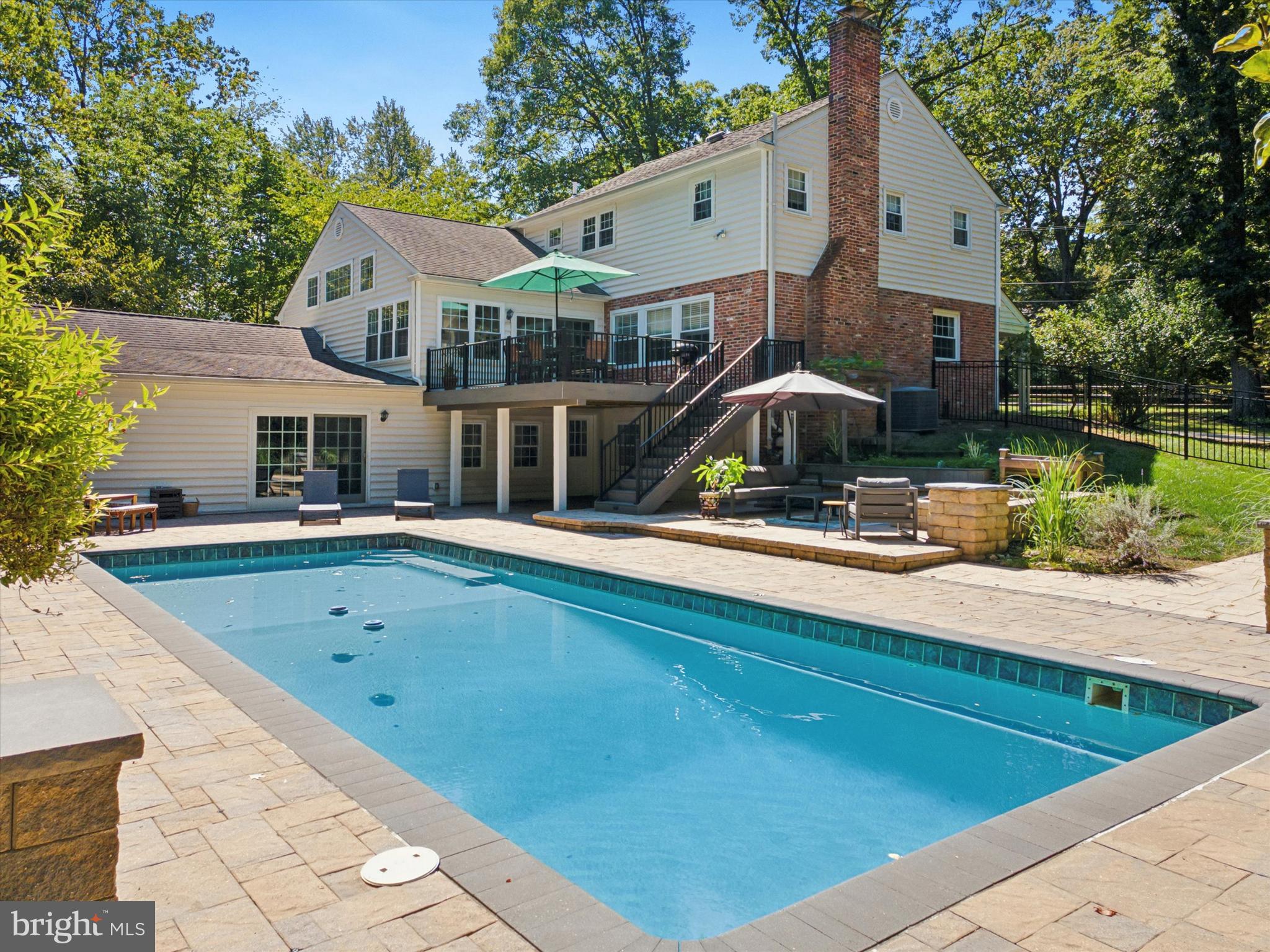 570 Fletcher Road Wayne, PA 19087 - Photo 8 of 54 a front view of house with yard and trees in the background