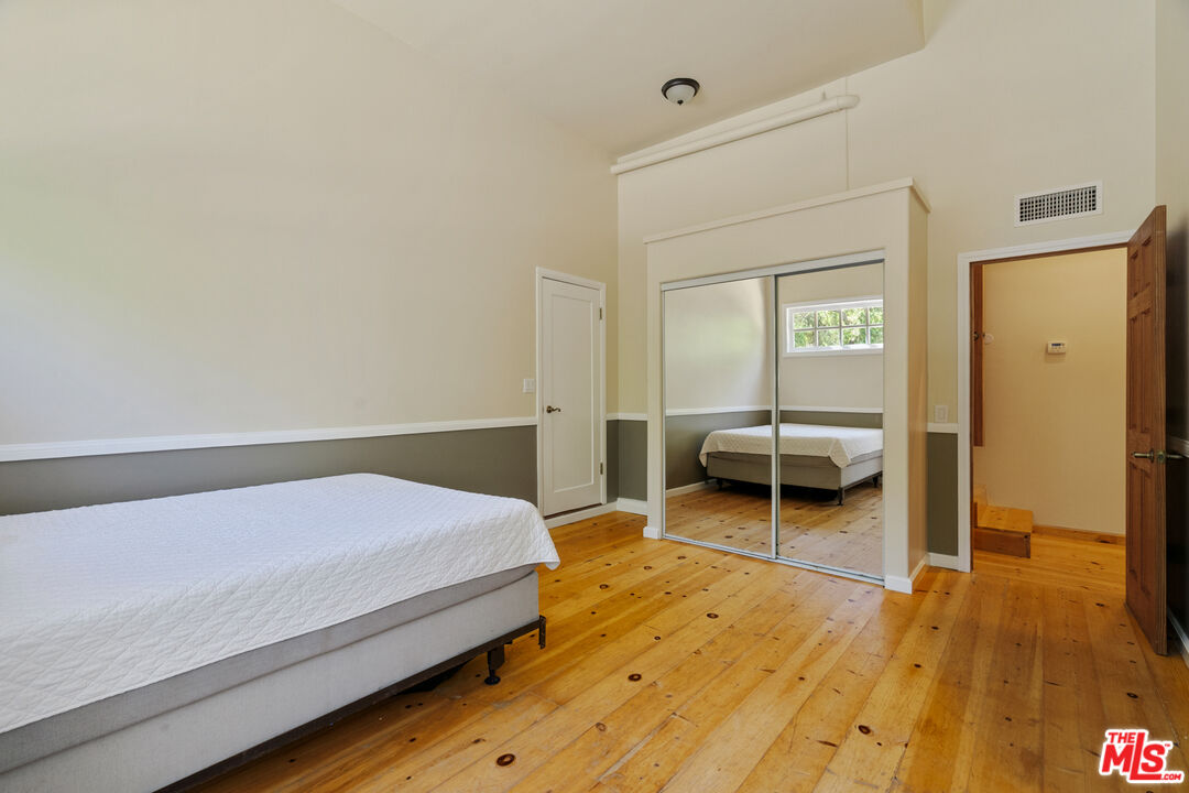 20912 Fontaine Road Topanga, CA 90290 - Photo 32 of 52 a bedroom with a bed and a view of bedroom