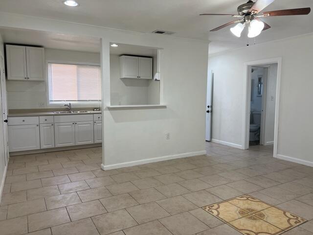 38879 Mesquite Road Palmdale, CA 93551 - Photo 6 of 12 a view of a kitchen with a sink and a window
