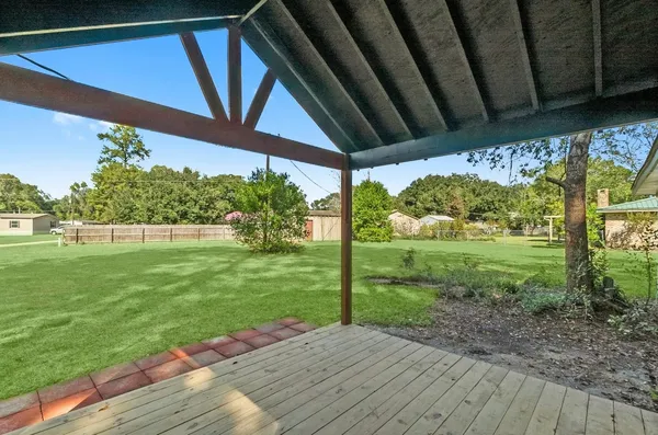 a view of backyard with green space