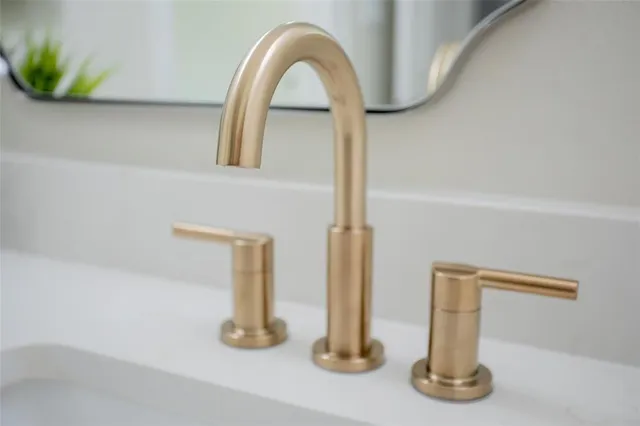 a close view of light fixtures and a sink