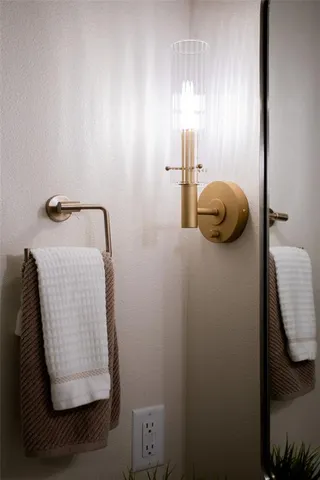 a bathroom with a sink and mirror