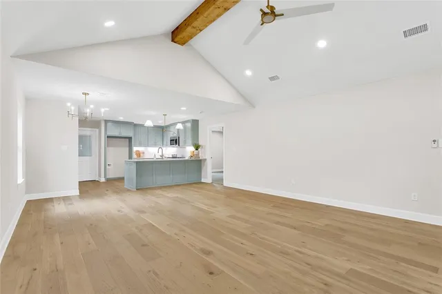 a view of a kitchen with a sink and a window