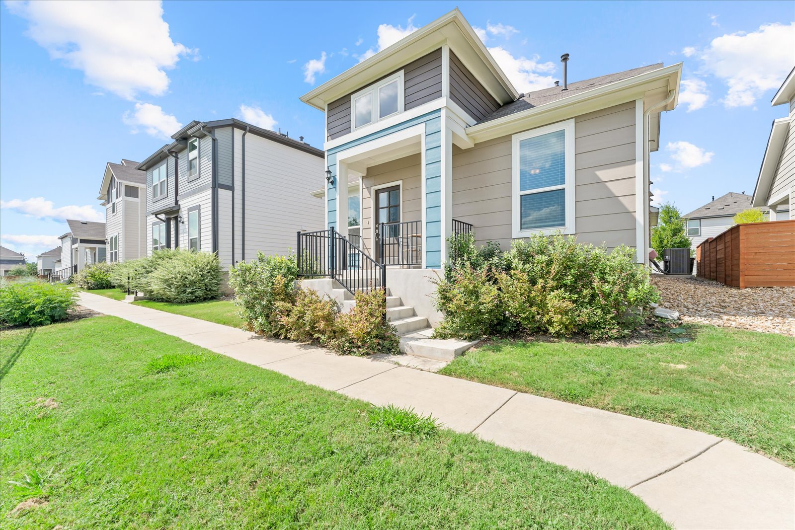 View of front of home featuring neighborhood sidewalk