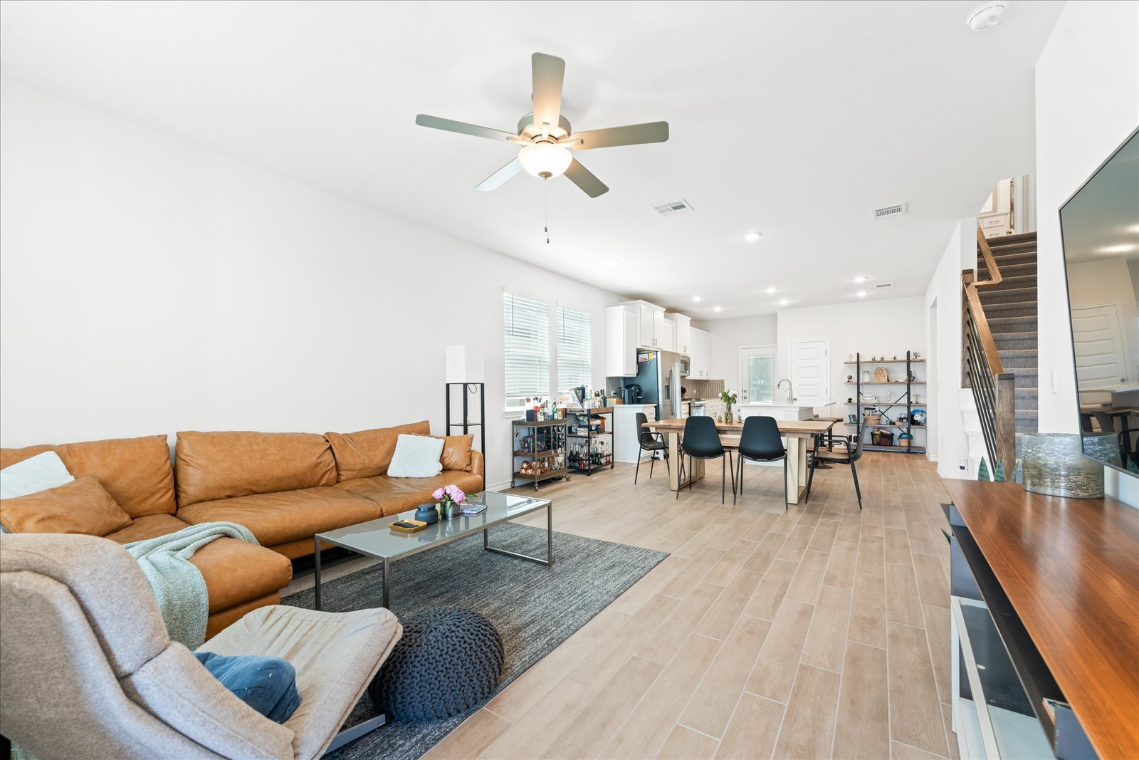 4607 Sweet Annie Path Austin, TX 78723 - Photo 4 of 29 Living room featuring wood floors, ceiling fans, and recessed lighting