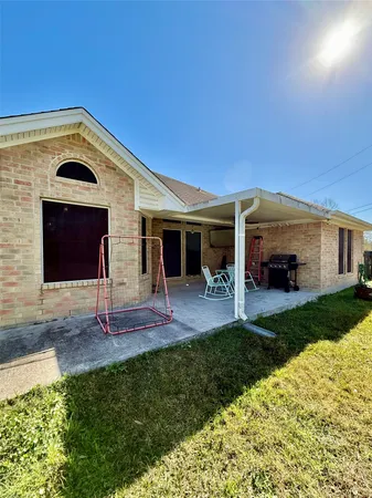 a front view of a house with a yard and porch