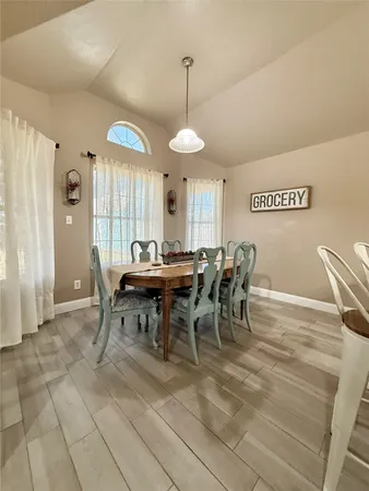 a view of a dining room with furniture