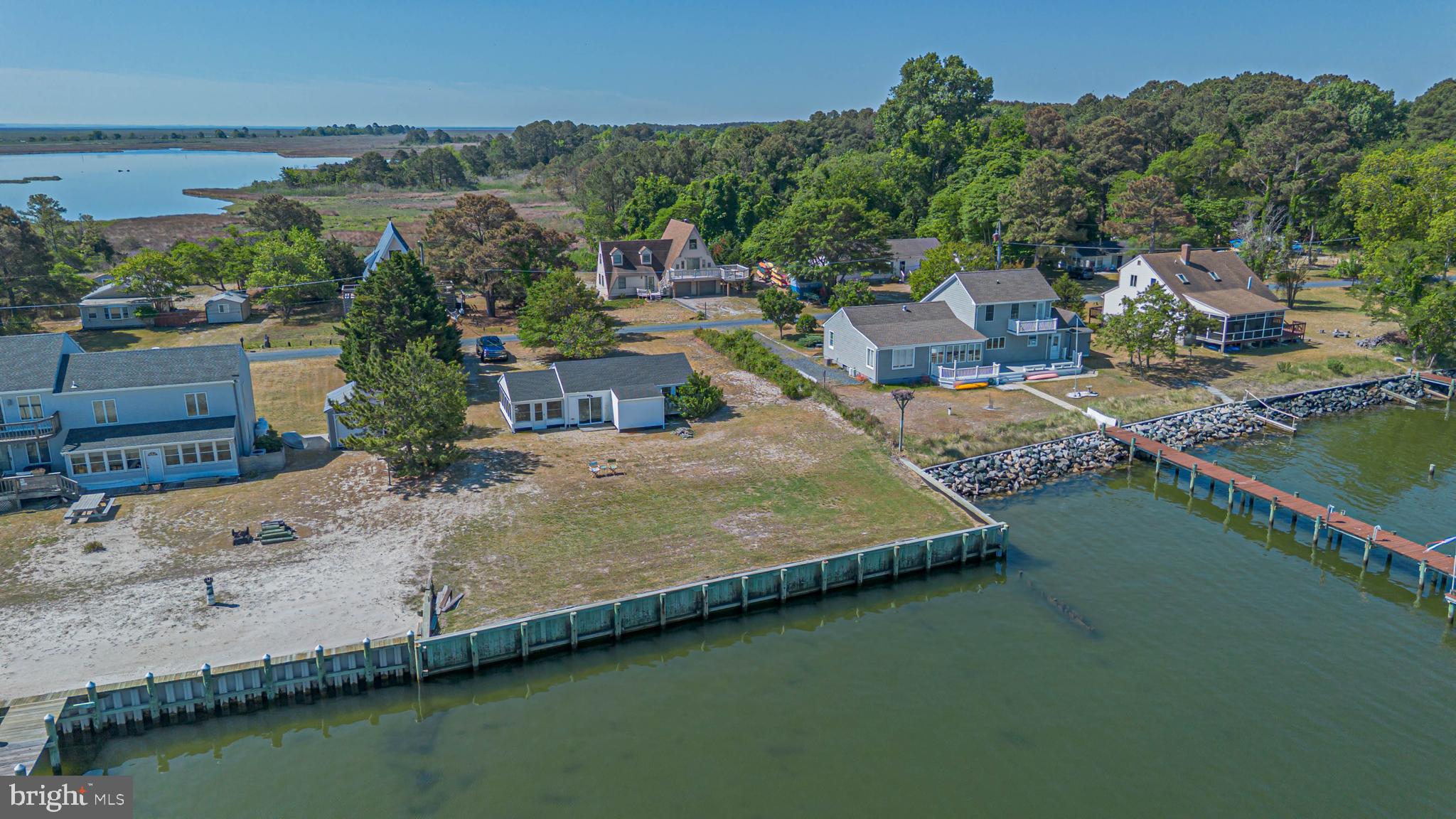 11152 Roland Parks Road Deal Island, MD 21821 - Photo 2 of 42 an aerial view of a house with a garden and lake view