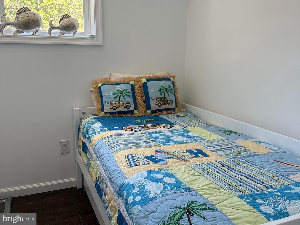 11152 Roland Parks Road Deal Island, MD 21821 - Photo 21 of 42 a bedroom with a bed and a window