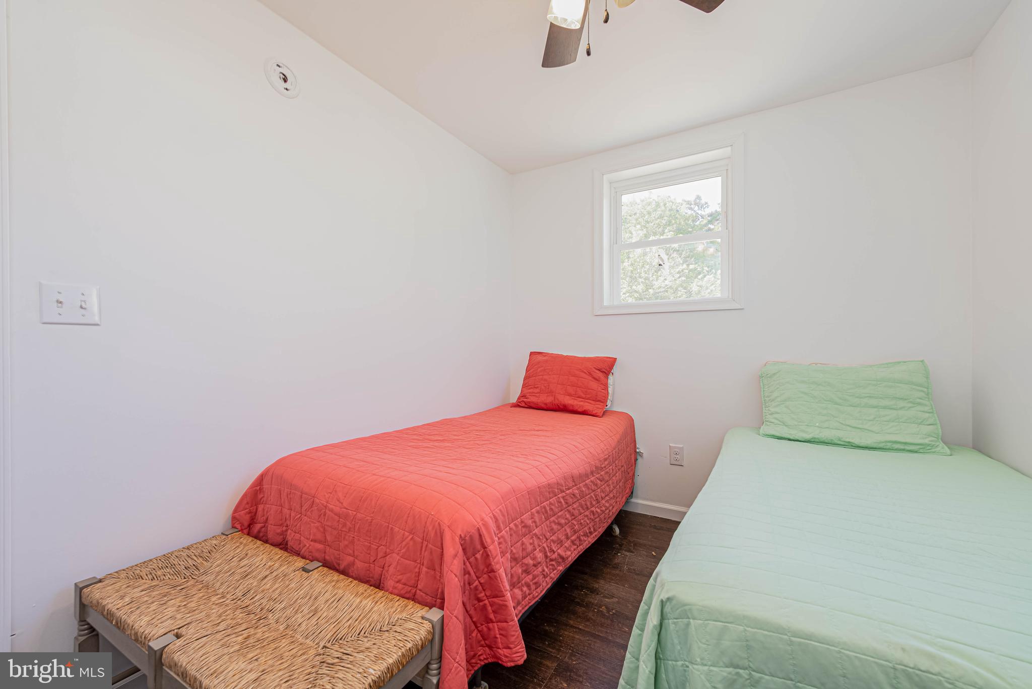 11152 Roland Parks Road Deal Island, MD 21821 - Photo 23 of 42 a bedroom with a bed and window