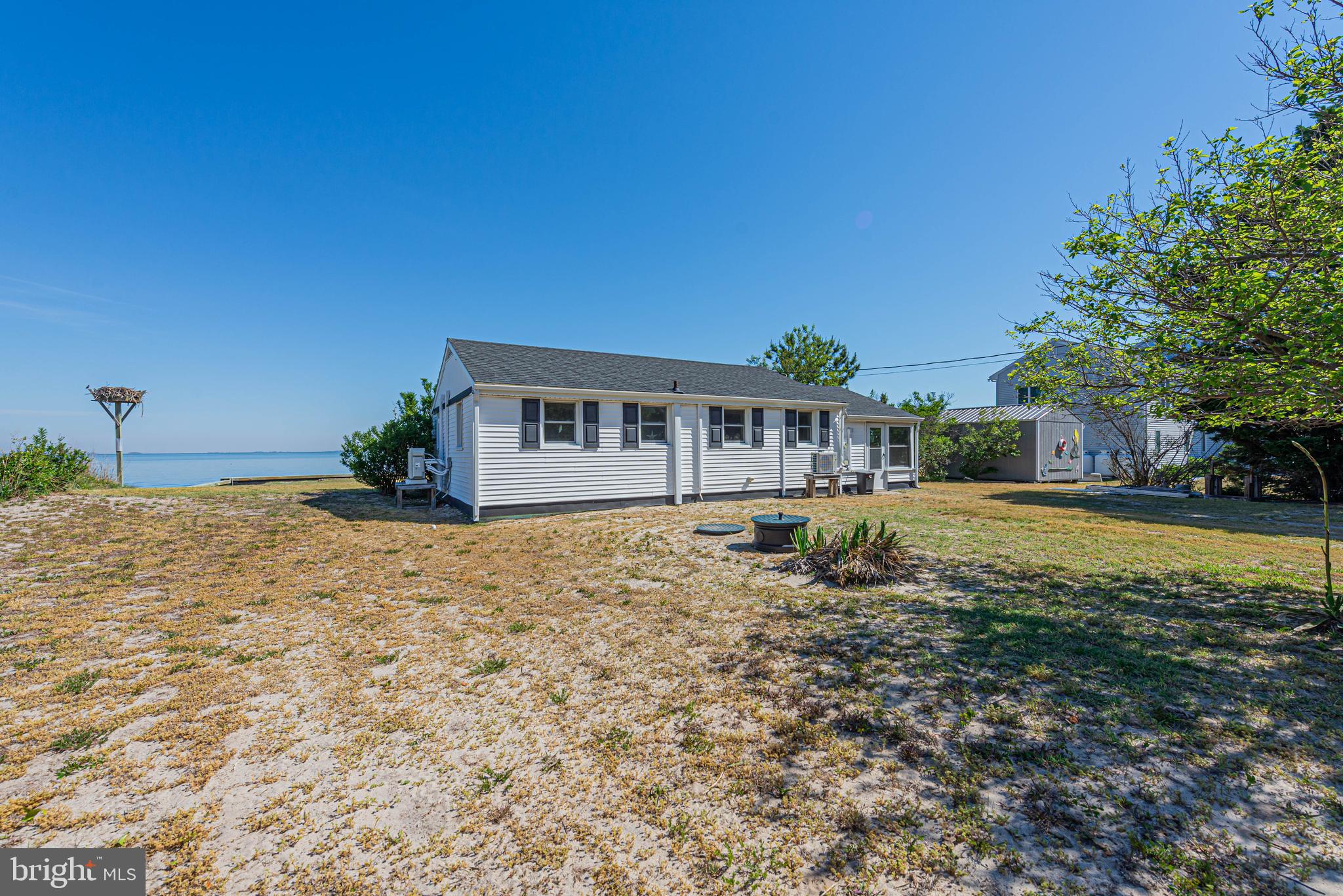 11152 Roland Parks Road Deal Island, MD 21821 - Photo 38 of 42 a house view with a swimming pool