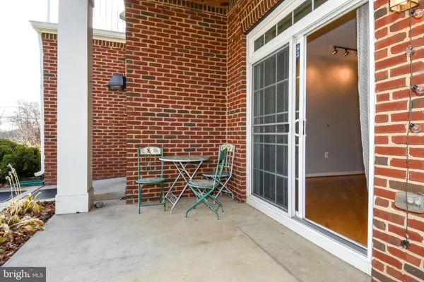 a backyard of a house with outdoor seating