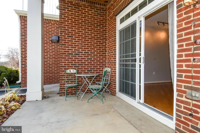 a backyard of a house with outdoor seating