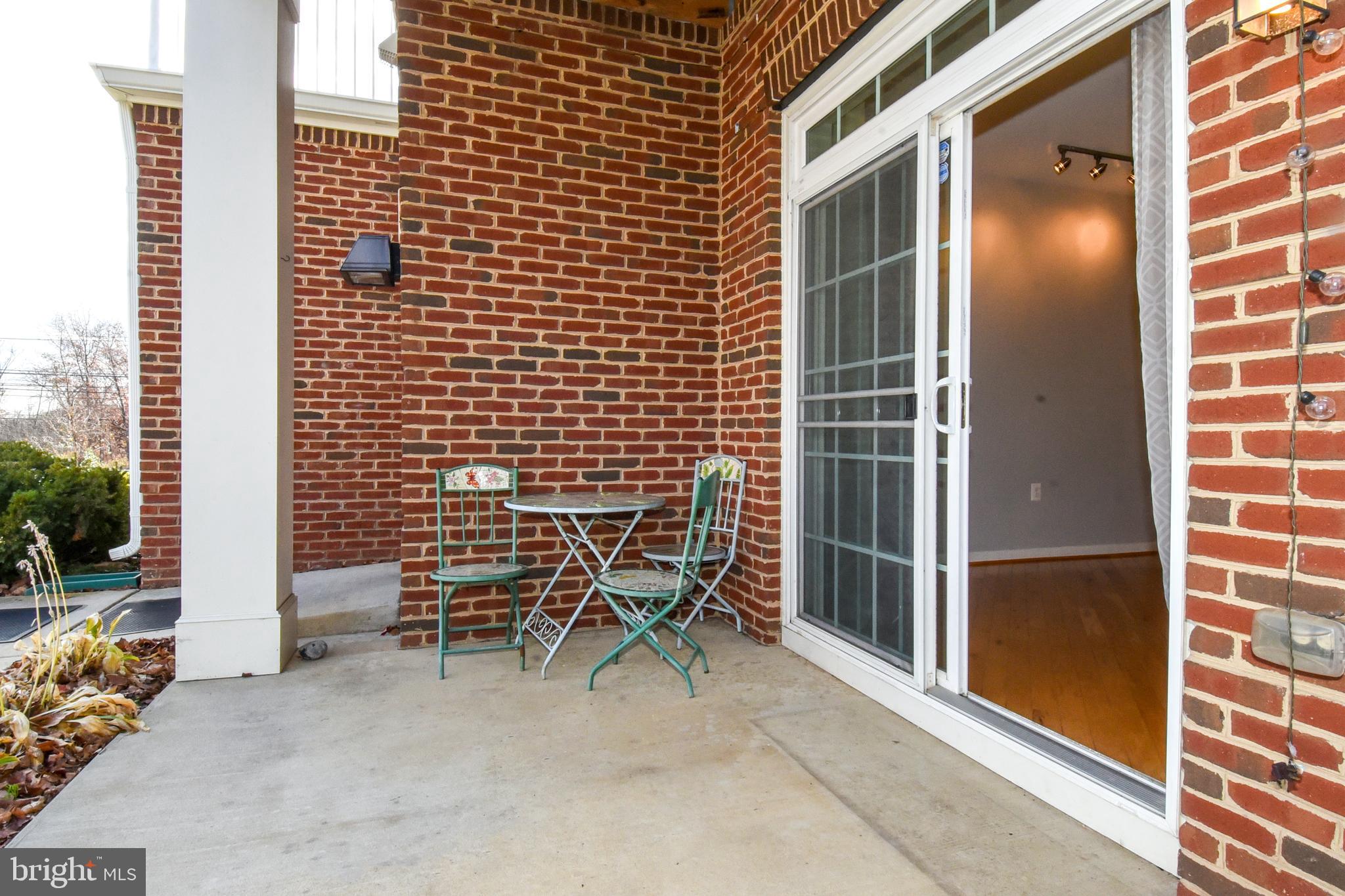 a backyard of a house with outdoor seating