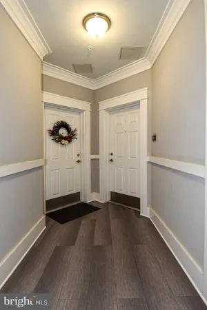 an empty room with wooden floor & closet