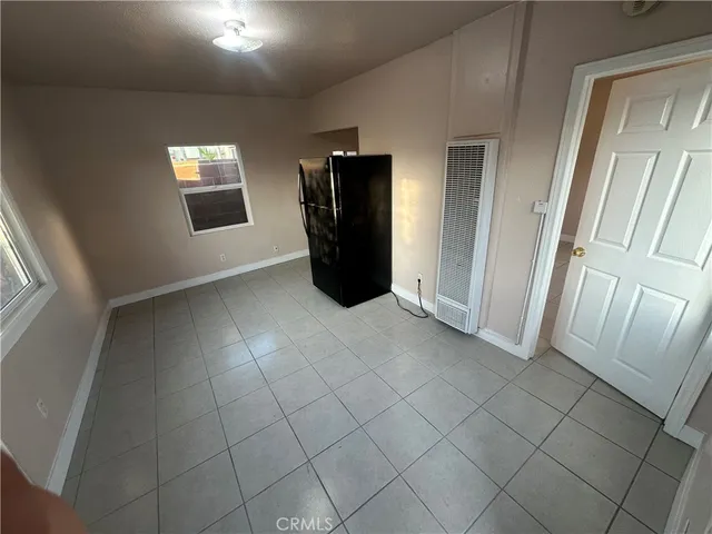 a view of an empty room and a window