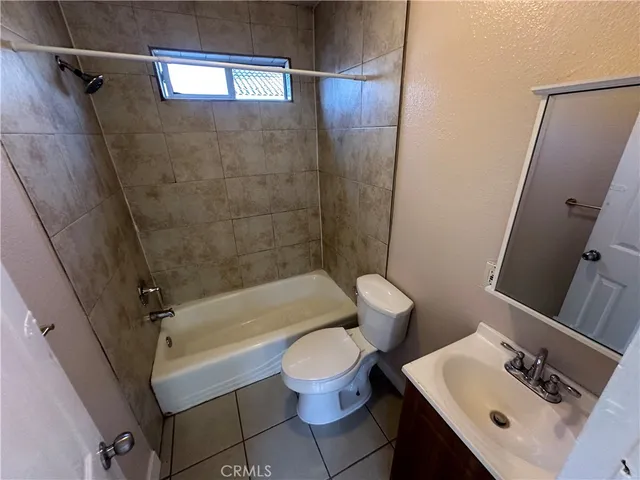a bathroom with a sink a toilet and a bathtub
