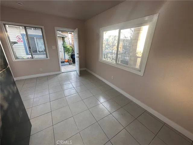 a view of an empty room with windows