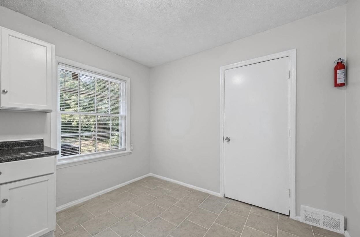 3843 Blue Jay Road Memphis, TN 38116 - Photo 13 of 23 a view of an empty room with a window