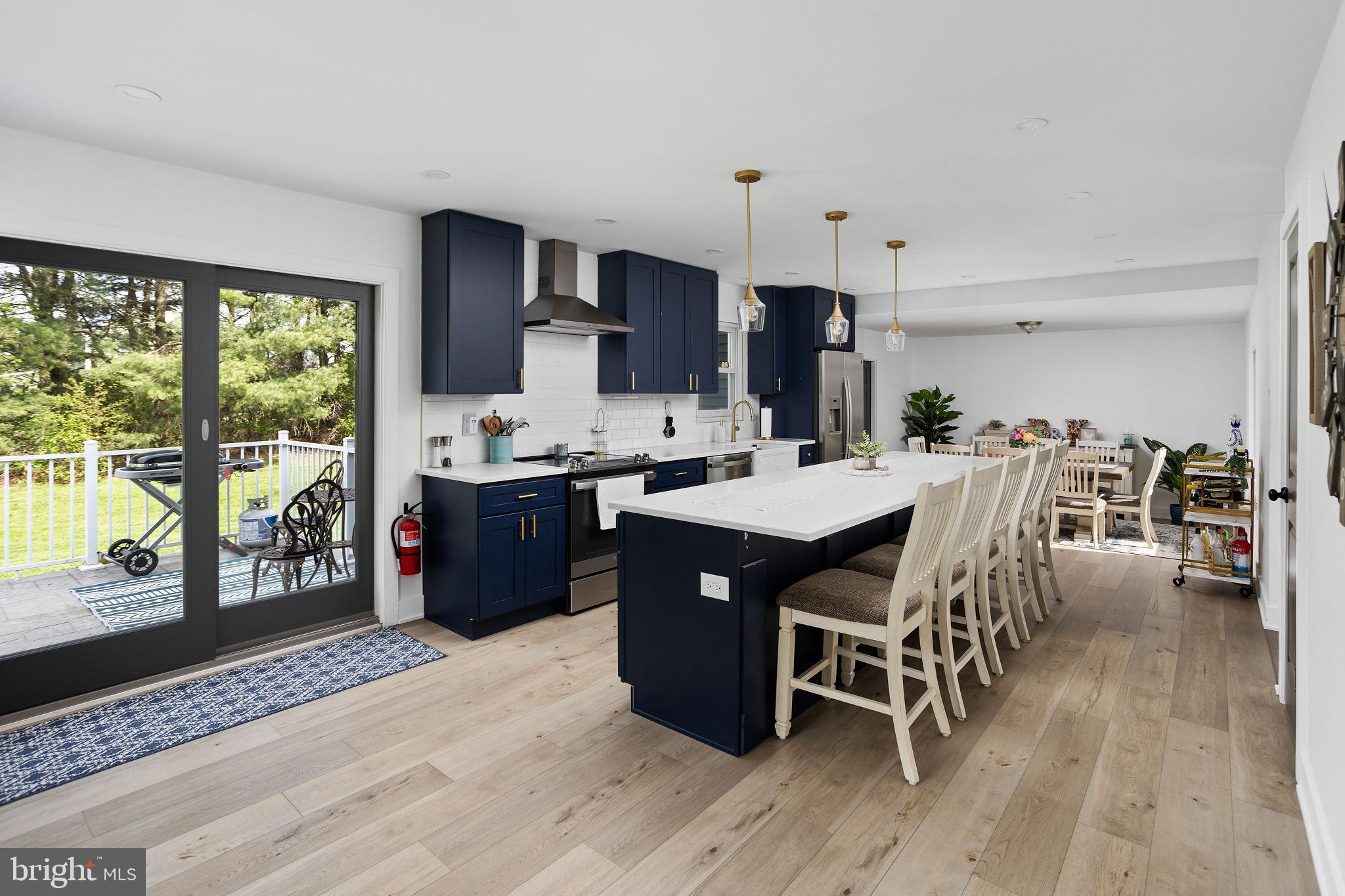 11 Bridge Road Lumberton, NJ 08048 - Photo 15 of 38 a kitchen with a table chairs sink and cabinets