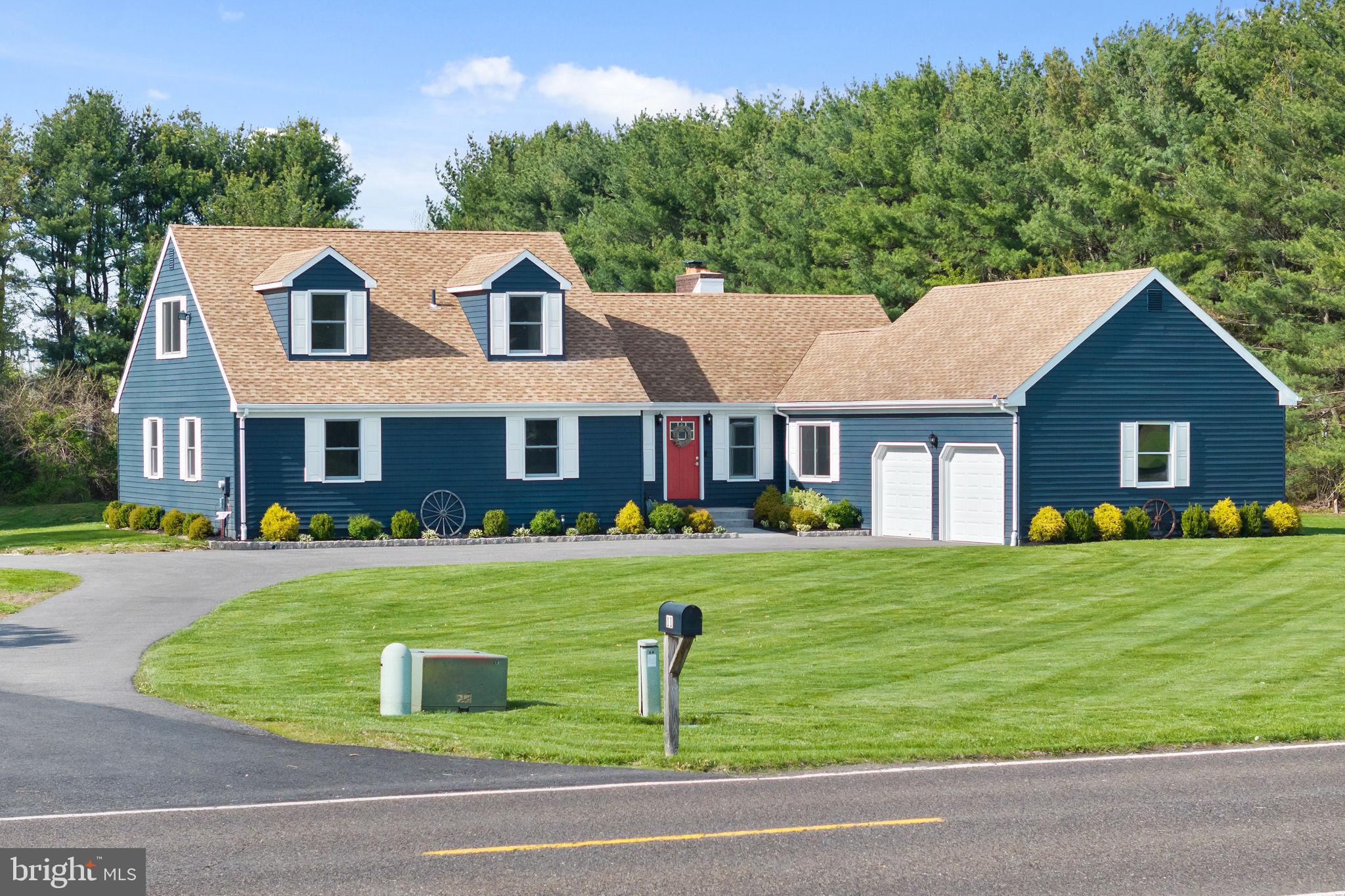 11 Bridge Road Lumberton, NJ 08048 - Photo 2 of 38 a front view of a house with a yard table and chairs