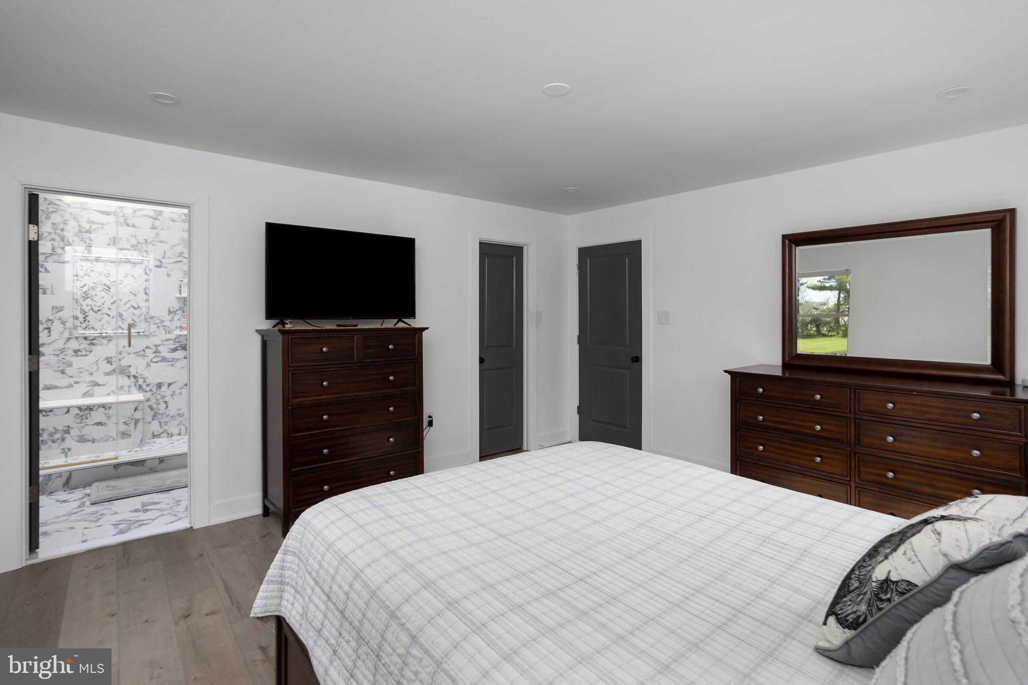 11 Bridge Road Lumberton, NJ 08048 - Photo 21 of 38 a bedroom with a bed and a flat screen tv