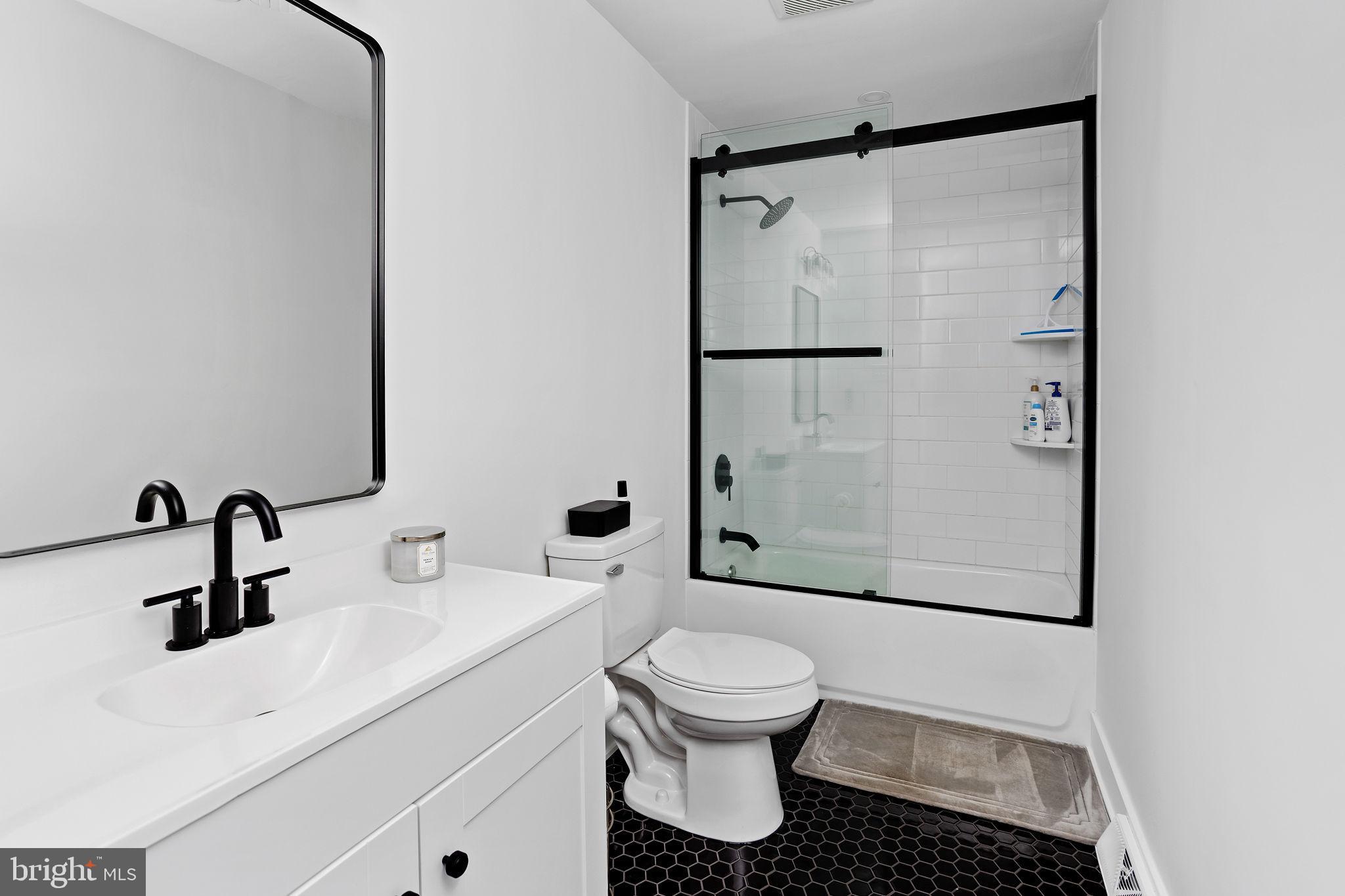 11 Bridge Road Lumberton, NJ 08048 - Photo 25 of 38 a bathroom with a sink toilet and shower